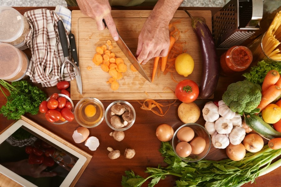 cutting vegetables using copper Damascus knives